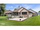 Expansive backyard with patio, lawn, mature trees, perfect for outdoor relaxation at 2818 Locust Dr, Indianapolis, IN 46227