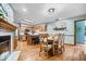 Open concept kitchen with bar seating, wooden cabinets, and seamlessly adjoined dining area at 2818 Locust Dr, Indianapolis, IN 46227