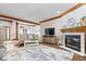 Comfortable living room with a fireplace, entertainment center, and wood flooring at 2818 Locust Dr, Indianapolis, IN 46227