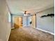 Spacious bedroom featuring sliding barn door, ceiling fan, natural light and neutral carpet at 2833 Desoto Way, Columbus, IN 47203