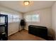 Bedroom featuring carpet floors, two windows with blinds, and closet space at 2833 Desoto Way, Columbus, IN 47203
