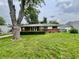 Beautiful home with mature trees, manicured lawn, and a classic brick facade at 2833 Desoto Way, Columbus, IN 47203