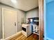 Functional laundry room with modern washing machine, ample storage shelves, and convenient access to utilities at 2833 Desoto Way, Columbus, IN 47203