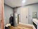 Efficient utility room featuring a water heater, ample space, and access to essential home systems at 2833 Desoto Way, Columbus, IN 47203