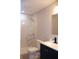 Modern bathroom featuring a new vanity, marbled tile walk-in shower, and a contemporary sink and faucet at 3026 Stuart St, Indianapolis, IN 46218