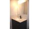 Stylish bathroom with a well-lit mirror, modern vanity, and countertop; a clean and updated space at 3026 Stuart St, Indianapolis, IN 46218