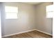 Well-lit bedroom showcasing sleek wood flooring and modern paint; offers a clean, inviting space at 3026 Stuart St, Indianapolis, IN 46218