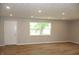 Bright living room with wood floors, neutral walls, and natural light from the large window at 3026 Stuart St, Indianapolis, IN 46218