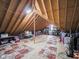 Spacious attic with wooden beams, patterned rugs, and ample storage potential at 312 Hawthorne Dr, Pittsboro, IN 46167