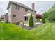 Brick home featuring a back patio perfect for outdoor relaxation and entertaining at 312 Hawthorne Dr, Pittsboro, IN 46167