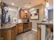 Charming wet bar features custom cabinets, a mini-fridge, and a unique countertop at 312 Hawthorne Dr, Pittsboro, IN 46167