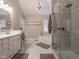 Elegant bathroom with a glass shower, soaking tub, double sinks, and granite countertops at 312 Hawthorne Dr, Pittsboro, IN 46167