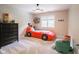 bedroom with a creative car bed, large window and a ceiling fan at 312 Hawthorne Dr, Pittsboro, IN 46167