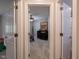 View into a bedroom with neutral walls, carpet, and a black dresser and light fixture at 312 Hawthorne Dr, Pittsboro, IN 46167