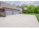 Two-car garage and a basketball hoop in the driveway and large backyard at 312 Hawthorne Dr, Pittsboro, IN 46167