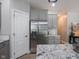 Modern kitchen featuring gray cabinetry, stainless steel refrigerator, and granite countertops at 312 Hawthorne Dr, Pittsboro, IN 46167