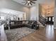 Open-concept living room featuring hardwood floors, a staircase, and a view of the kitchen at 312 Hawthorne Dr, Pittsboro, IN 46167