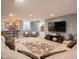 Comfortable living area featuring an entertainment center, wet bar, and neutral color palette at 312 Hawthorne Dr, Pittsboro, IN 46167