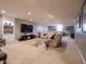 Bright living room with plush carpet, a large TV, and cozy seating for entertaining at 312 Hawthorne Dr, Pittsboro, IN 46167