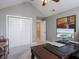 Spacious office with a large desk, double closets, and neutral walls and carpet at 312 Hawthorne Dr, Pittsboro, IN 46167