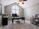 Well-lit home office with a large window, vaulted ceiling, and ceiling fan at 312 Hawthorne Dr, Pittsboro, IN 46167