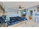 Inviting bedroom features a ceiling fan, carpet, and a plush bed with a blue comforter at 3349 Capsella Ln, Indianapolis, IN 46203