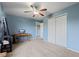 Spacious bedroom with blue walls, carpet flooring, ceiling fan, and a double door closet at 3349 Capsella Ln, Indianapolis, IN 46203