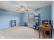 Bedroom showcasing a ceiling fan, window, neutral carpet, and home entertainment setup at 3349 Capsella Ln, Indianapolis, IN 46203