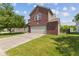 Charming two-story home featuring a brick facade, attached garage and well-maintained lawn at 3349 Capsella Ln, Indianapolis, IN 46203