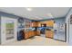 Well-equipped kitchen with oak cabinets, stainless steel appliances, and access to the backyard deck at 3349 Capsella Ln, Indianapolis, IN 46203