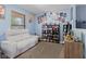 Media room with comfortable seating, movie posters and shelving at 3349 Capsella Ln, Indianapolis, IN 46203