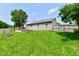 Nice backyard with a wooden deck and a fire pit perfect for outdoor gatherings at 3429 Pavetto Ln, Indianapolis, IN 46203