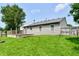 The backyard features a spacious wooden deck and a well-maintained lawn at 3429 Pavetto Ln, Indianapolis, IN 46203