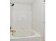 Bright bathroom features a shower and tub combination with classic white tile surround at 3429 Pavetto Ln, Indianapolis, IN 46203