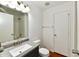 Bathroom featuring a modern sink, vanity, and a shower/tub with a tiled wall at 3429 Pavetto Ln, Indianapolis, IN 46203