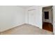 Neutral bedroom showcasing double closets with moon decor and carpeted floors at 3429 Pavetto Ln, Indianapolis, IN 46203