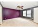 Spacious bedroom with plush carpet, ceiling fan, neutral paint, and natural light at 3429 Pavetto Ln, Indianapolis, IN 46203