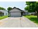 Charming single-Gathering home with a well-maintained lawn and attached two car garage at 3429 Pavetto Ln, Indianapolis, IN 46203