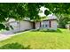 Charming single-Gathering home with a well-maintained lawn and attached two car garage at 3429 Pavetto Ln, Indianapolis, IN 46203