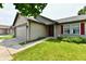 Charming single-Gathering home with a well-maintained lawn and attached two car garage at 3429 Pavetto Ln, Indianapolis, IN 46203