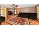 Spacious living room featuring a cozy fireplace, plush seating, and wood-look flooring at 3429 Pavetto Ln, Indianapolis, IN 46203