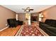 Spacious living room featuring a cozy fireplace, plush seating, and wood-look flooring at 3429 Pavetto Ln, Indianapolis, IN 46203