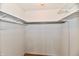 Spacious walk-in closet offering ample storage space with shelving and a hanging rod at 3429 Pavetto Ln, Indianapolis, IN 46203