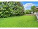 Large backyard with plenty of green space and mature trees, offering a private and serene outdoor environment at 4007 Knollwood Ave, Franklin, IN 46131