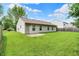 Backyard of home, with a grass lawn and partial fence at 4007 Knollwood Ave, Franklin, IN 46131