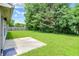 Backyard of home with a concrete patio and a large yard at 4007 Knollwood Ave, Franklin, IN 46131