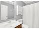 Bathroom with single sink, white vanity, white medicine cabinet and shower at 4007 Knollwood Ave, Franklin, IN 46131