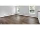Bright bedroom featuring laminate floors, two windows and neutral walls providing a comfortable living space at 4007 Knollwood Ave, Franklin, IN 46131