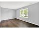 Bedroom features hardwood floors and a window looking out to the neighborhood at 4007 Knollwood Ave, Franklin, IN 46131