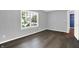 Bedroom features hardwood floors and a window looking out to the neighborhood at 4007 Knollwood Ave, Franklin, IN 46131
